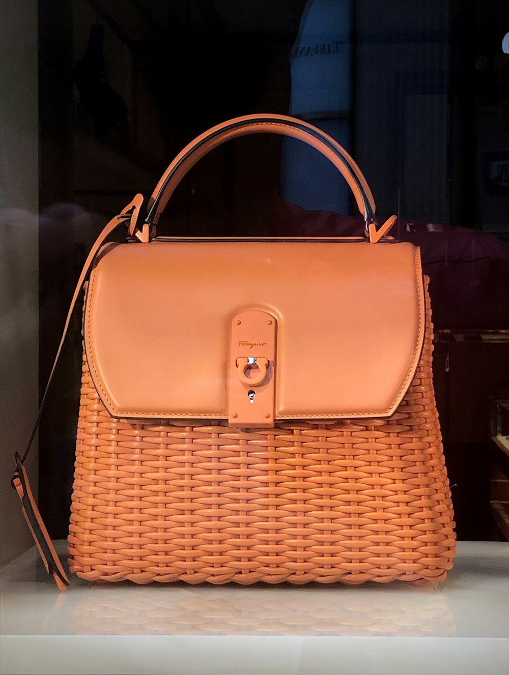 brown leather handbag on brown wooden table