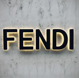 the word fendi spelled with neon lights on a wall