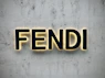 the word fendi spelled with neon lights on a wall