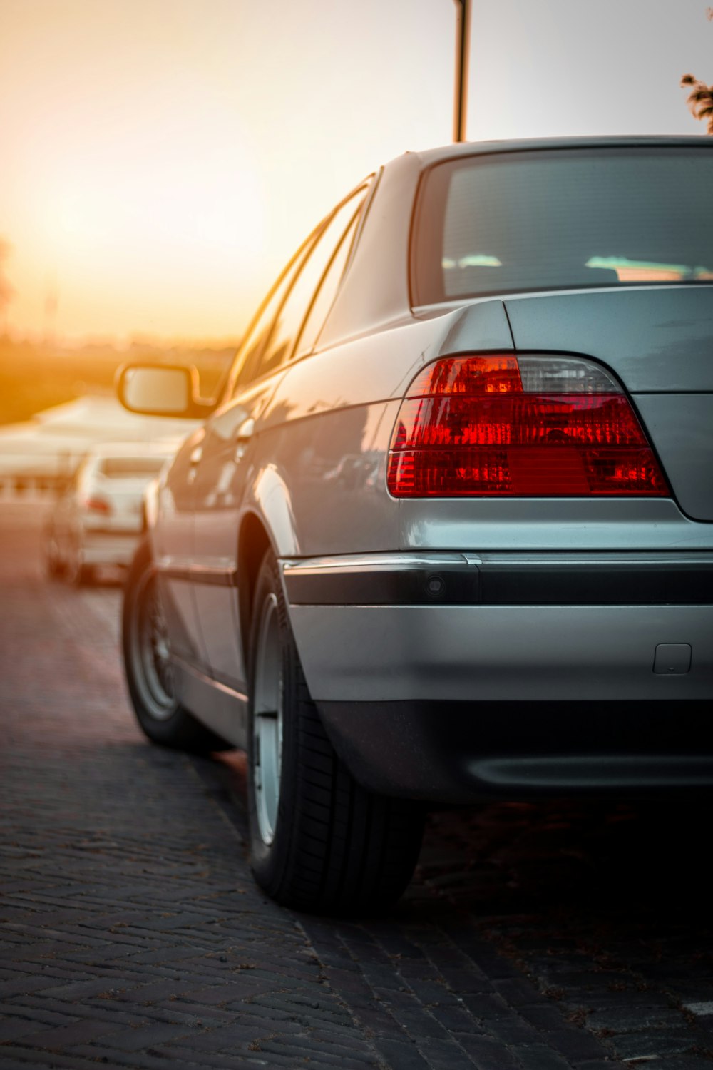 silver car on road during sunset