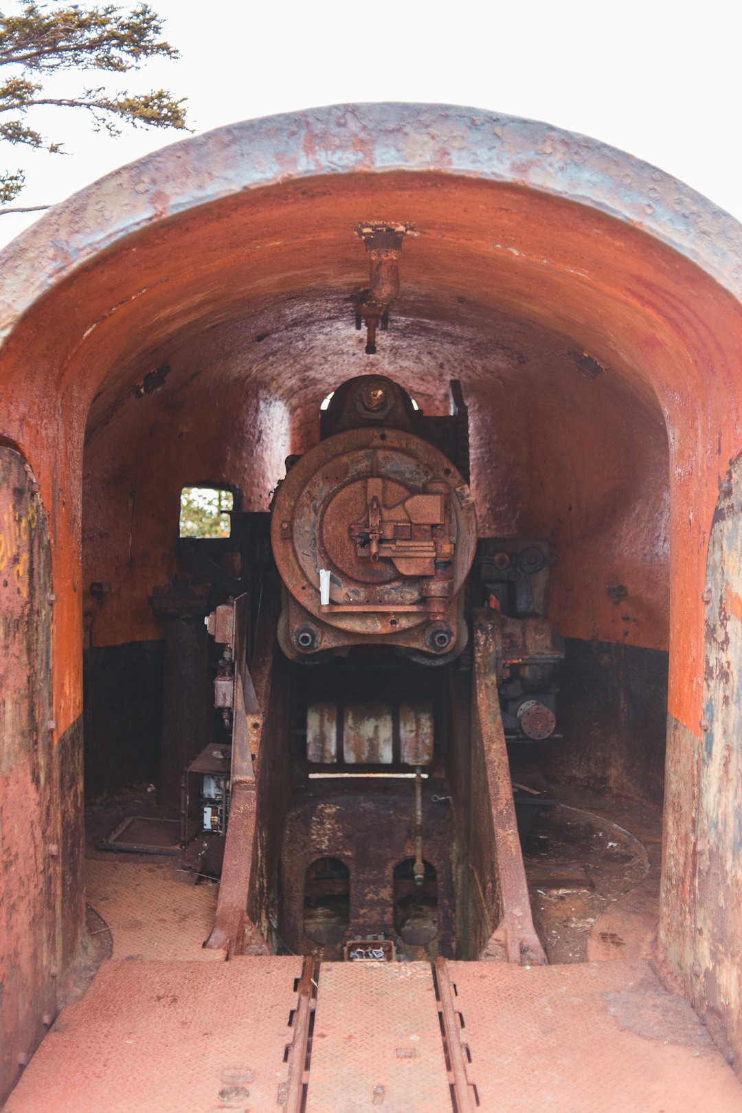 brown metal machine on brown concrete tunnel