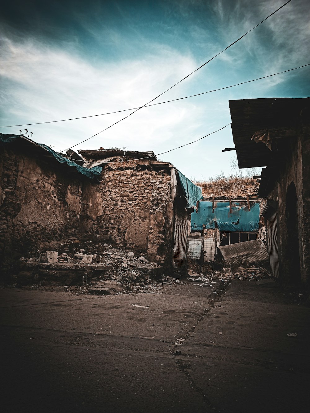 brown concrete houses under white clouds during daytime