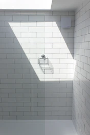 white ceramic bathtub with faucet