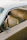 Close-up of a polished car interior featuring pristine seats and dashboard, cleaned professionally at a client's home.