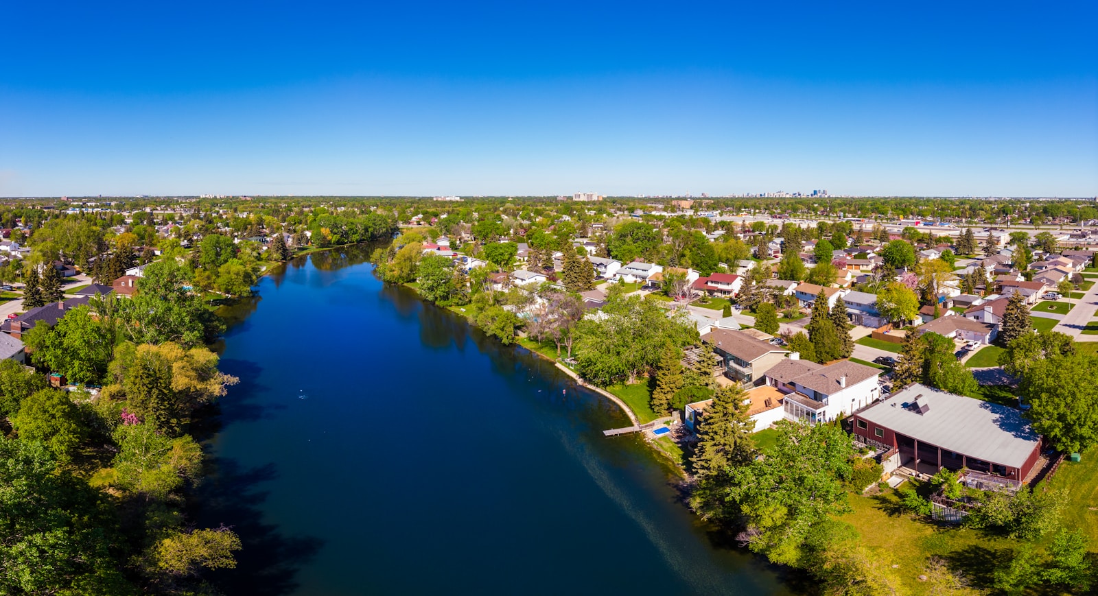 river running through a suburban neighbourhood