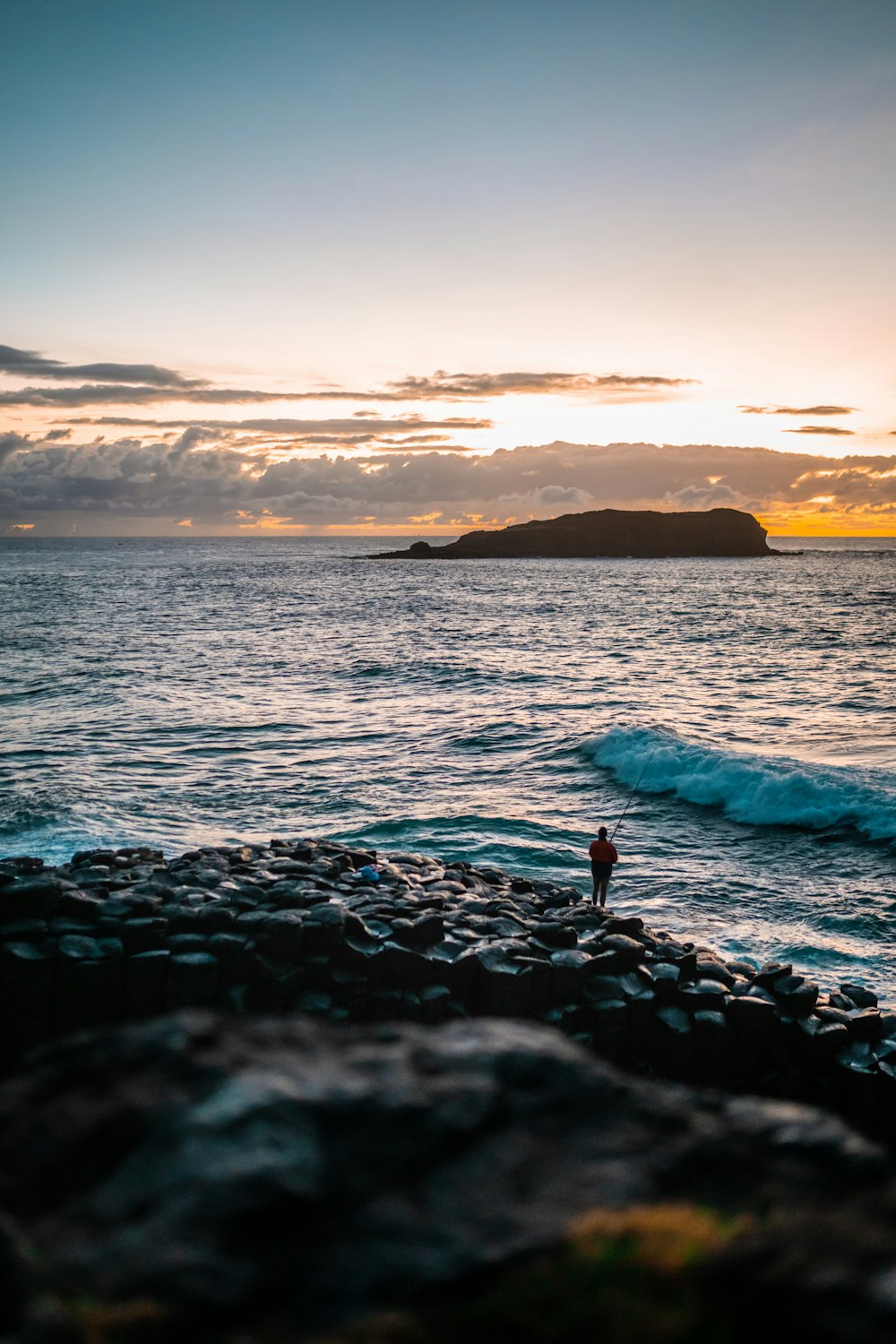 person in water during sunset