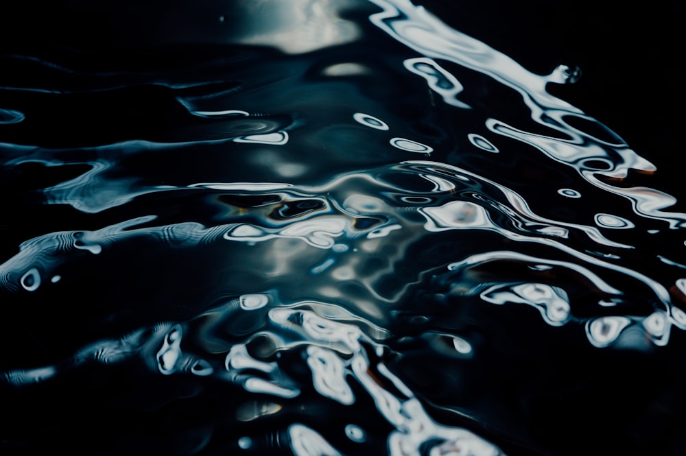 water drops on white surface