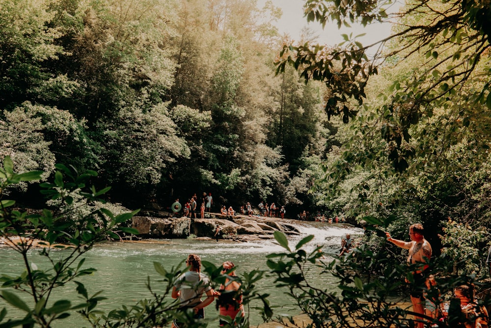 people riding on boat on river during daytime