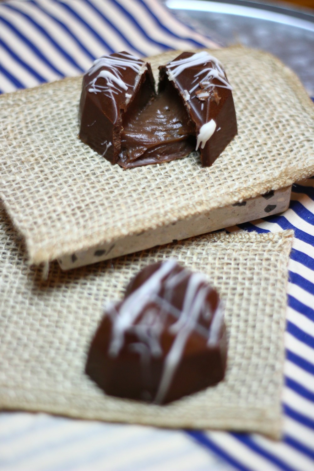 chocolate cake on white and blue checkered textile