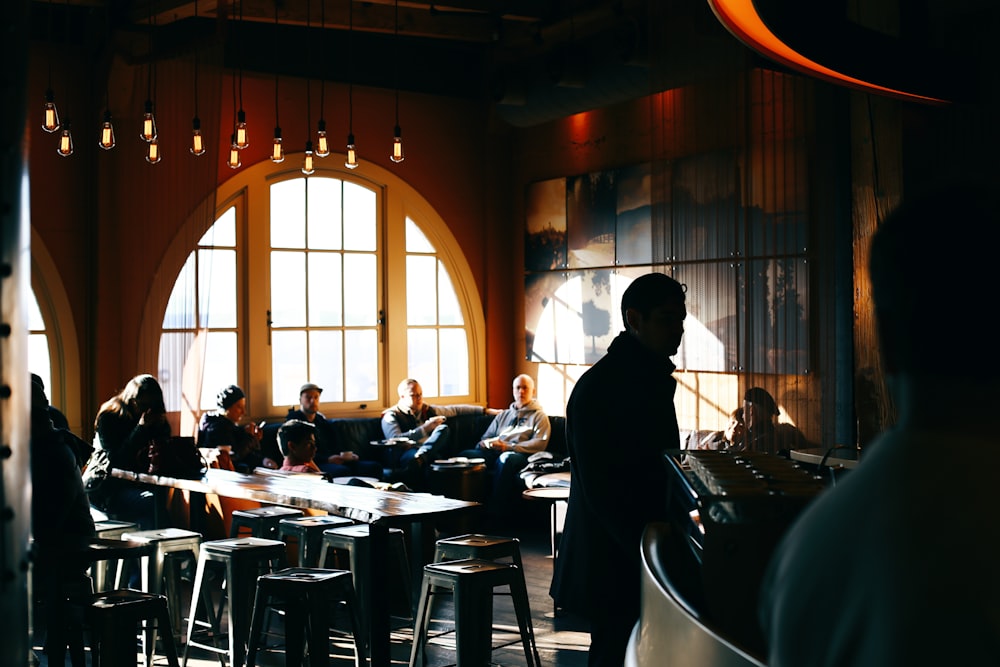 people sitting on chair inside restaurant