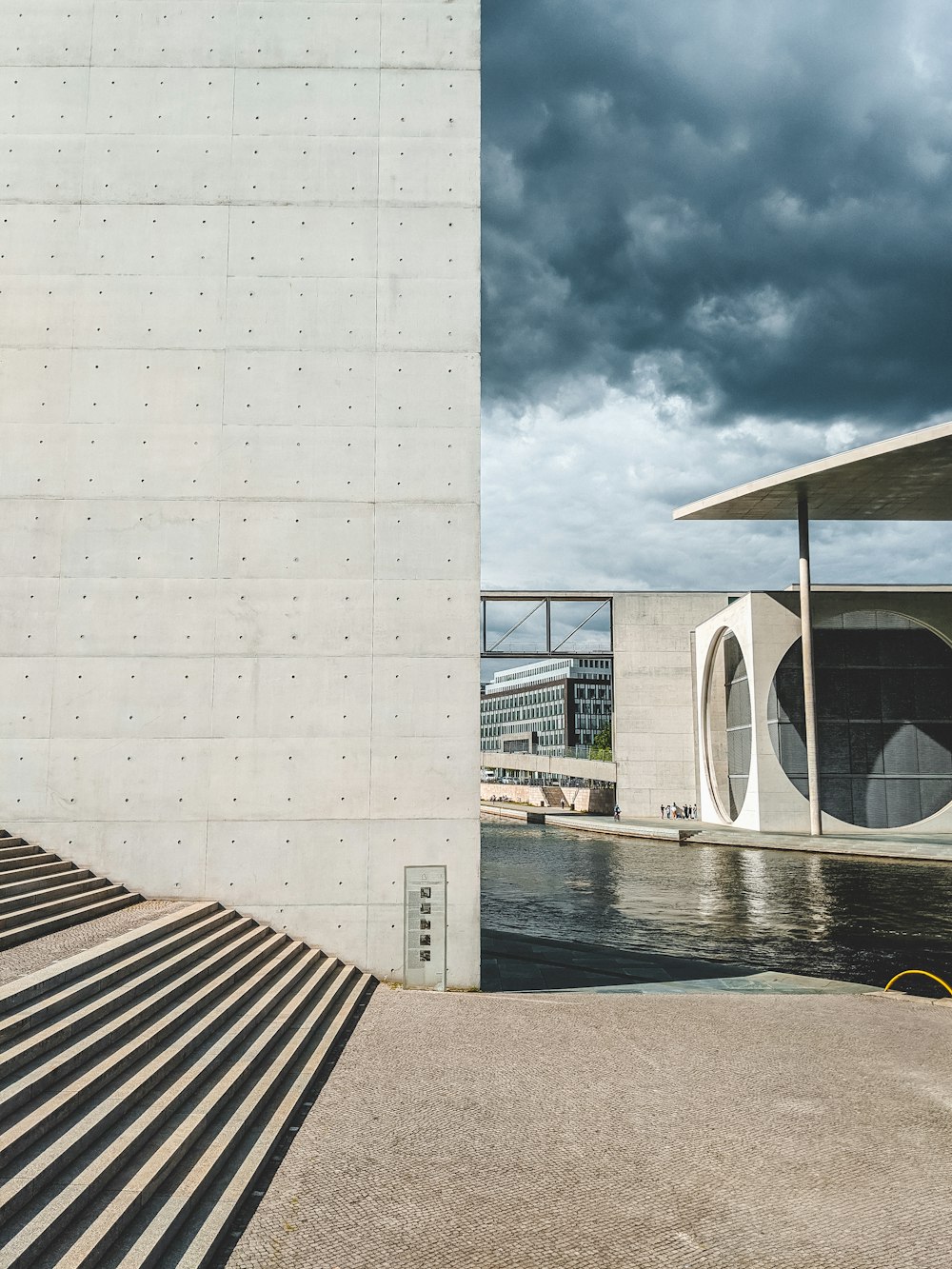 white concrete building near body of water during daytime