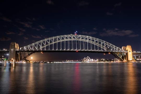 white bridge over body of water during night time in Blues Point Reserve Australia