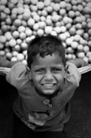 grayscale photo of smiling boy