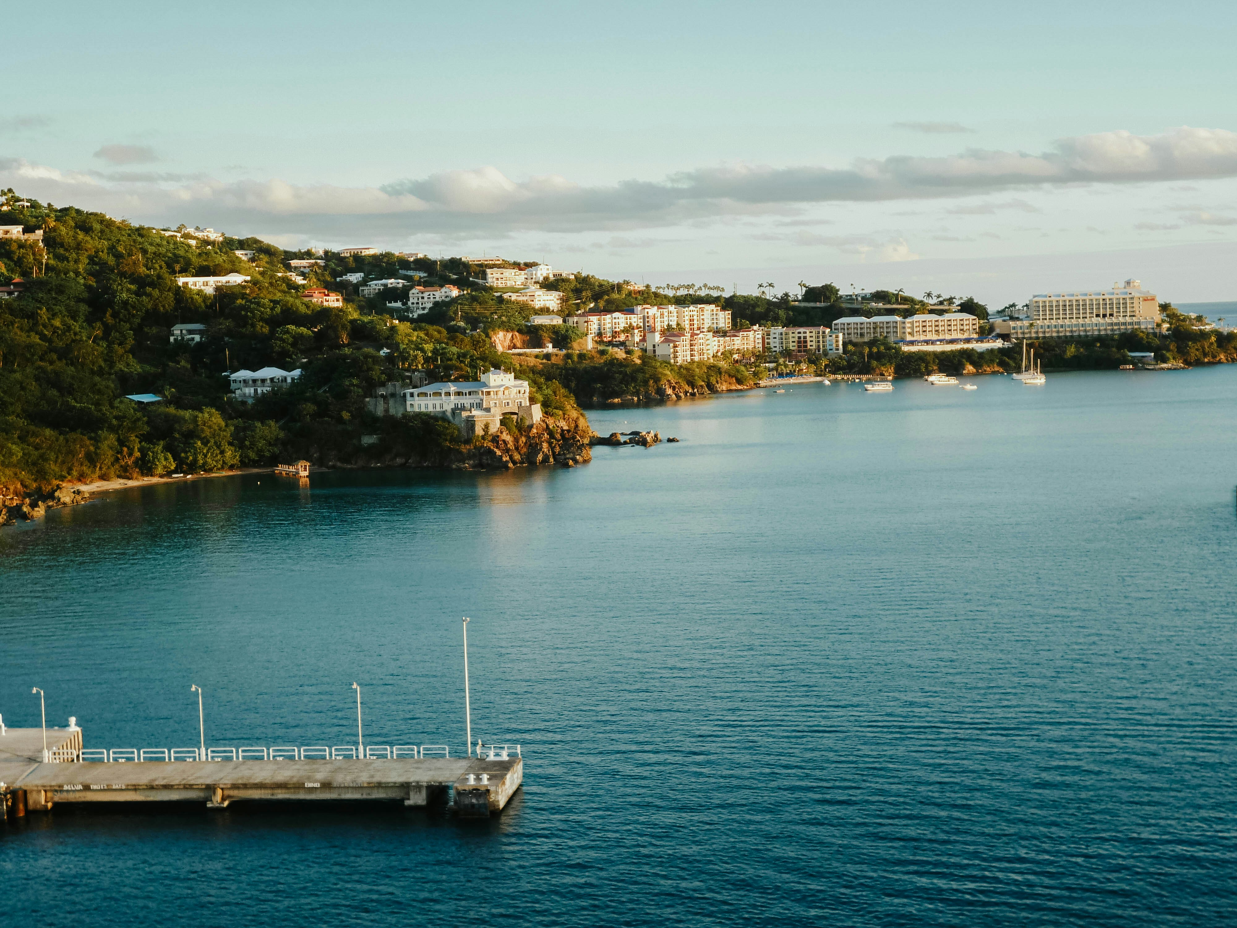 white boat on body of water during daytime