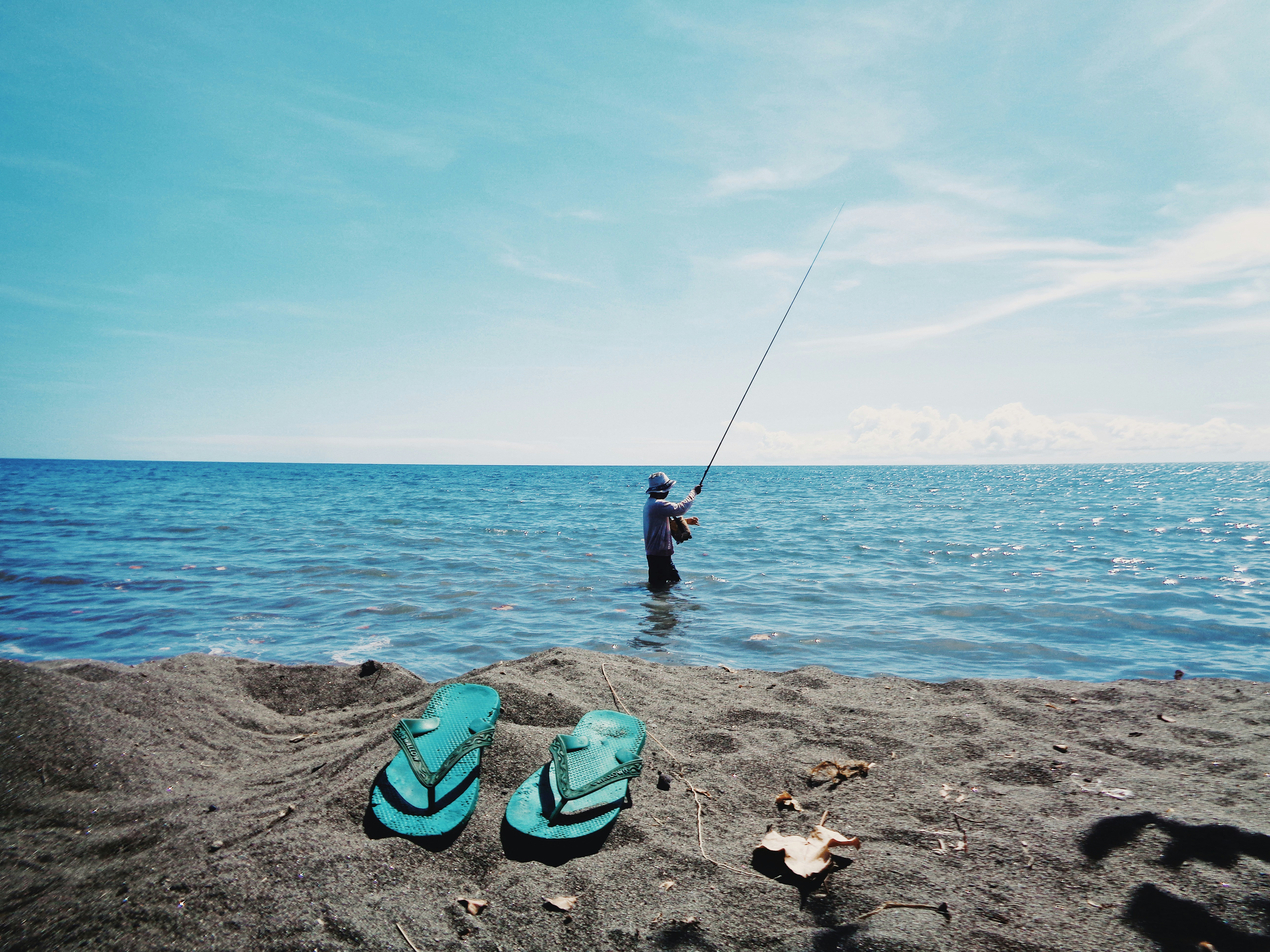 2 person fishing on sea during daytime
