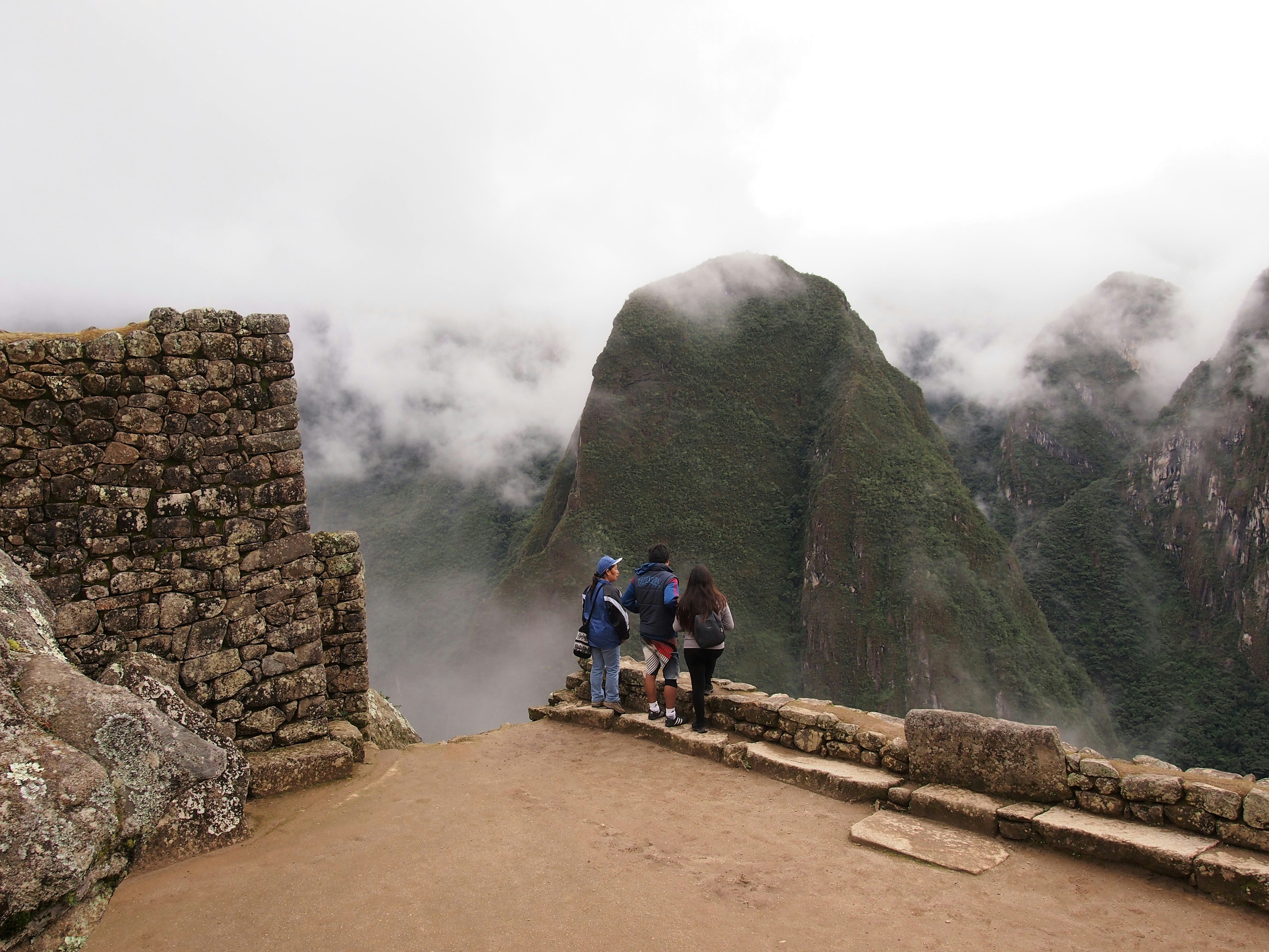 Sunrise over Machu Picchu with visible stone structures