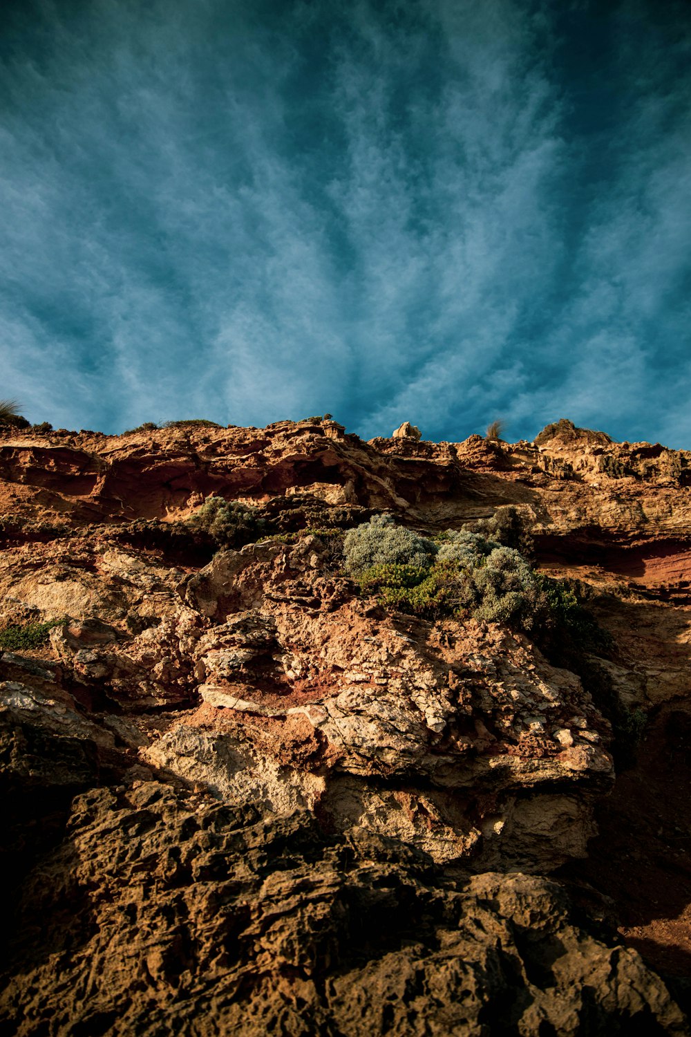 brown rocky mountain under blue sky during daytime