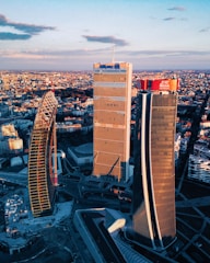 Aerial view of a modern city skyline at sunset.