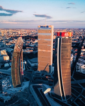 Aerial view of a modern city skyline at sunset.