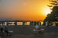 A sunset view over Rincon, Georgia, with community members gathered for an outdoor wellness activity.