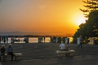 A sunset view over Rincon, Georgia, with community members gathered for an outdoor wellness activity.
