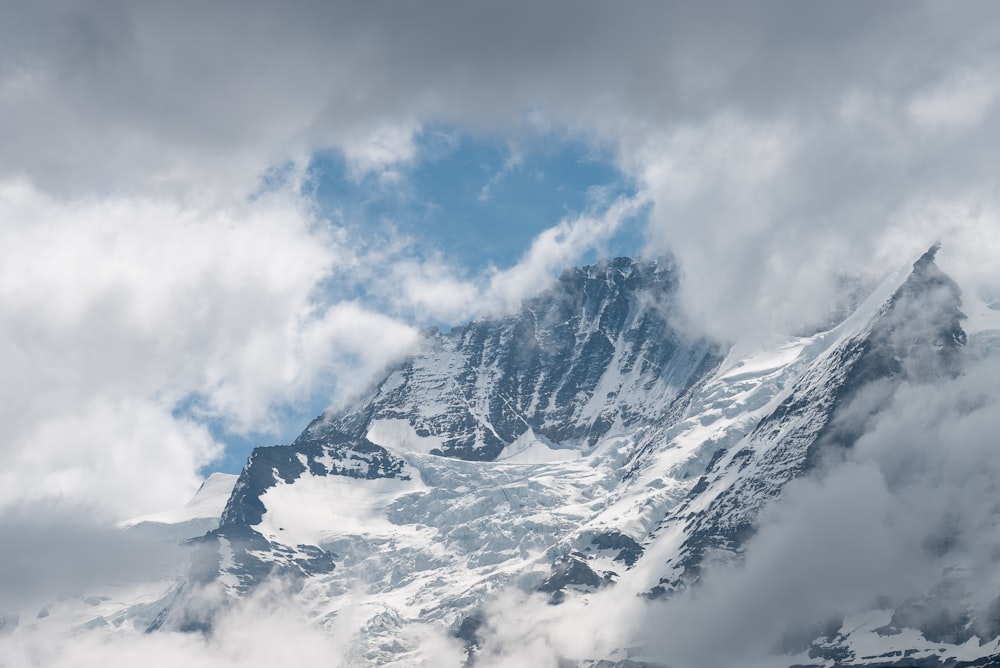 snow covered mountain under blue sky during daytime