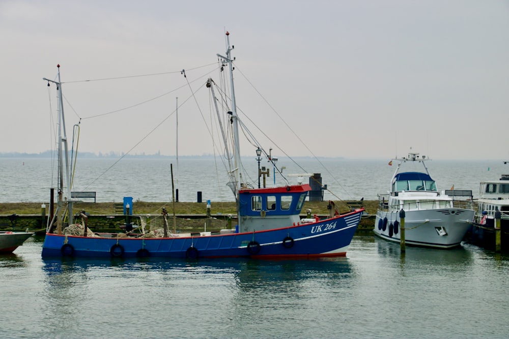 blue and brown boat on sea during daytime