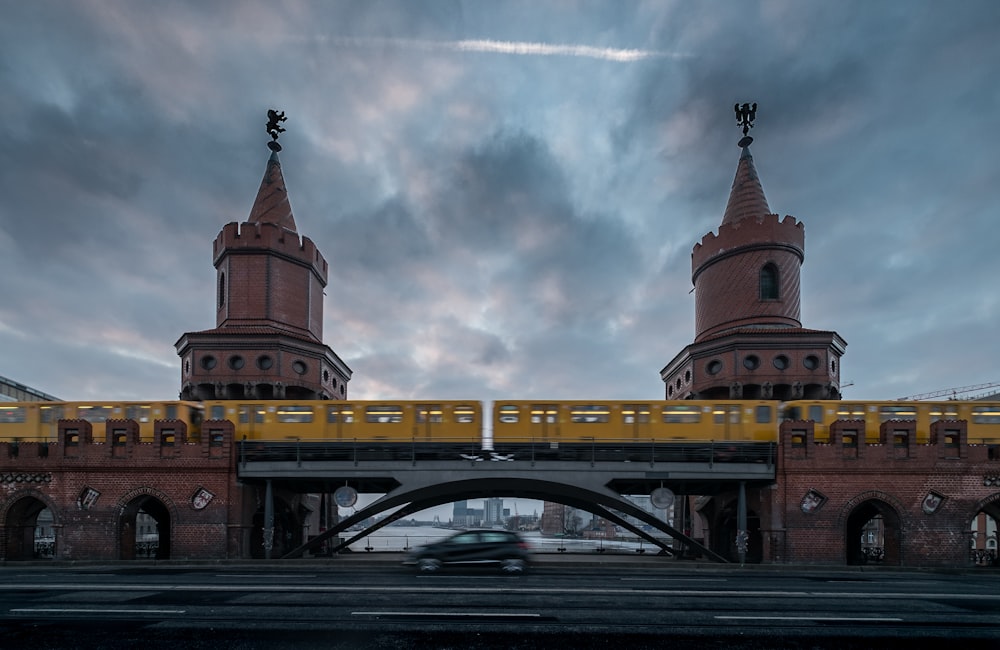 brown and white concrete building under cloudy sky during daytime