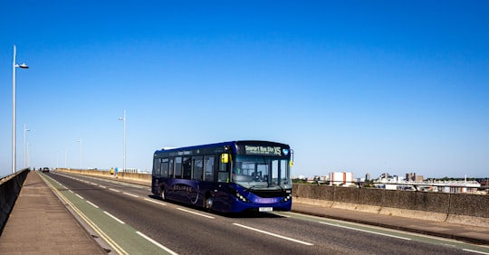 blue and yellow bus on road during daytime in Itchen Bridge United Kingdom