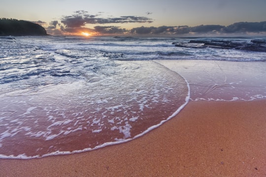 sea waves crashing on shore during sunset in Sydney NSW Australia
