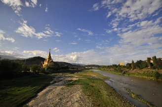 A vibrant collage showing the five rivers of Punjab flowing through lush green fields under a bright sky.