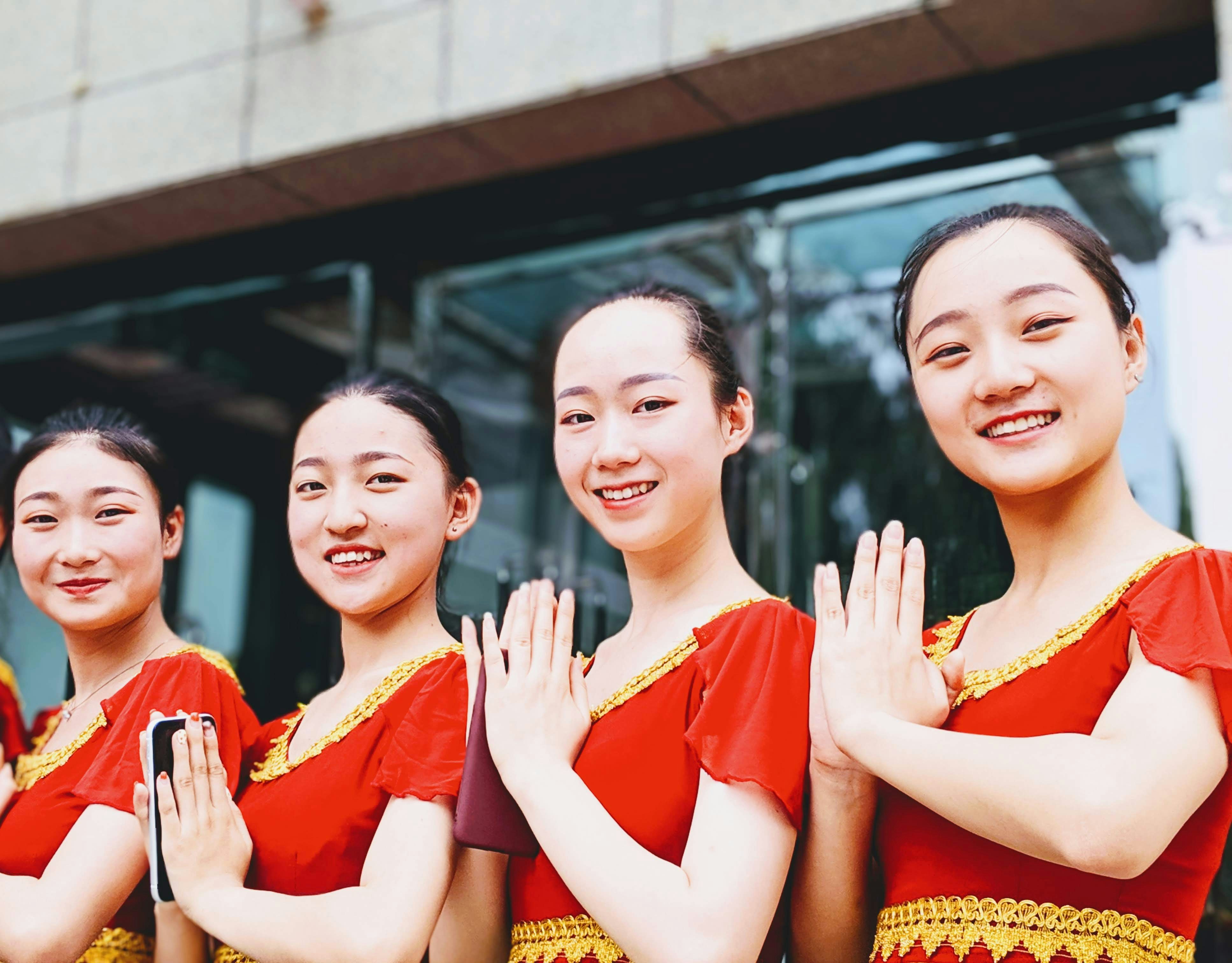 Chinese dancers doing Indian namaste
