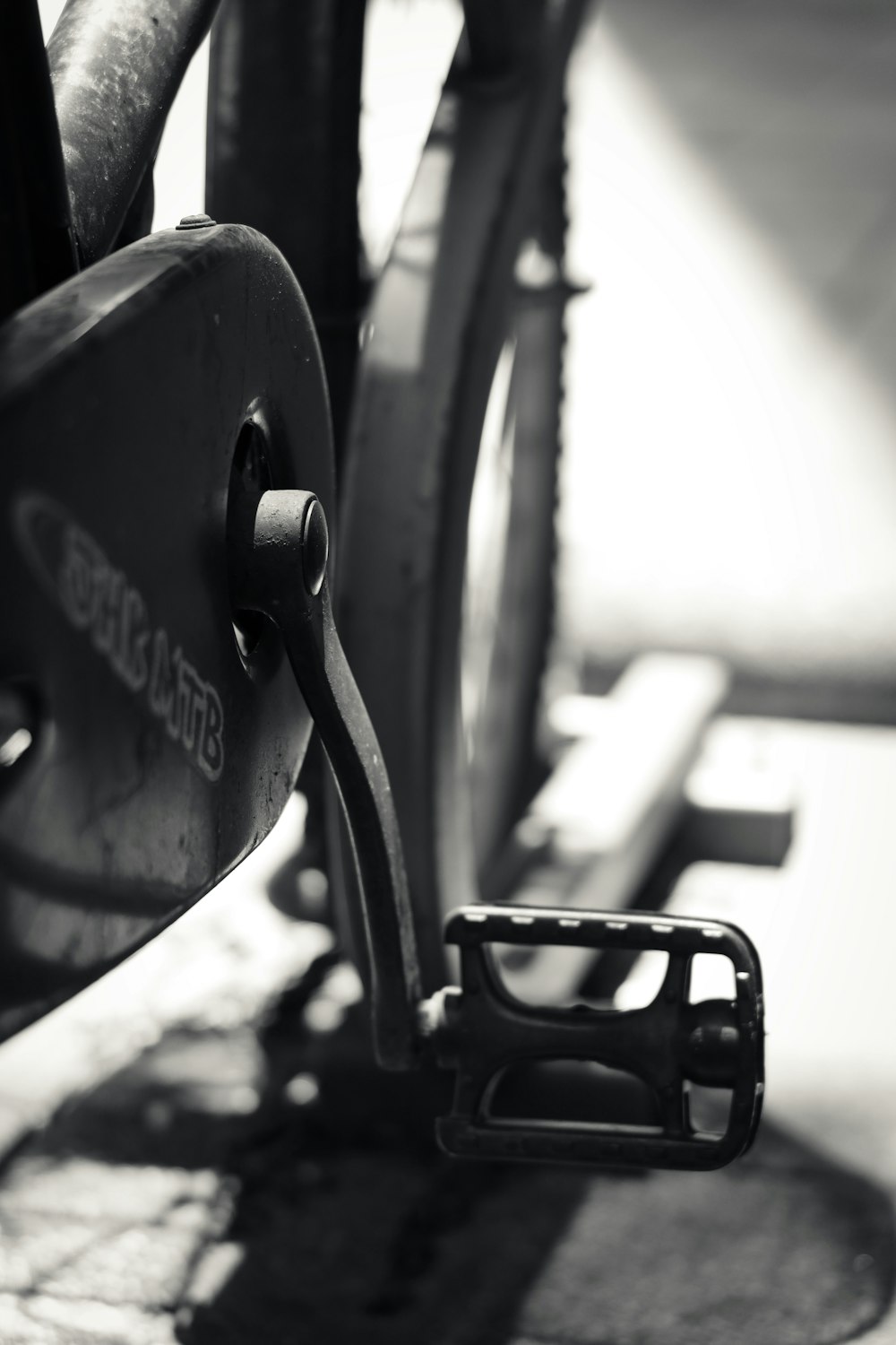 black bicycle wheel in grayscale photography