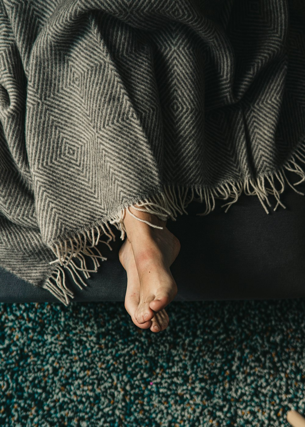 person holding black and white textile