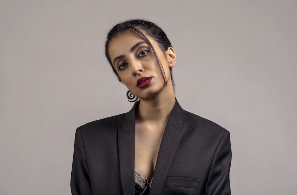 woman in black blazer with red lipstick