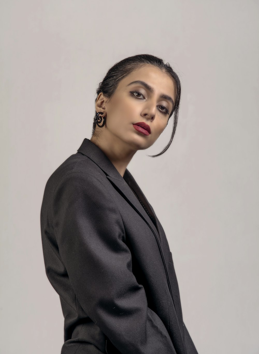 woman in black blazer standing