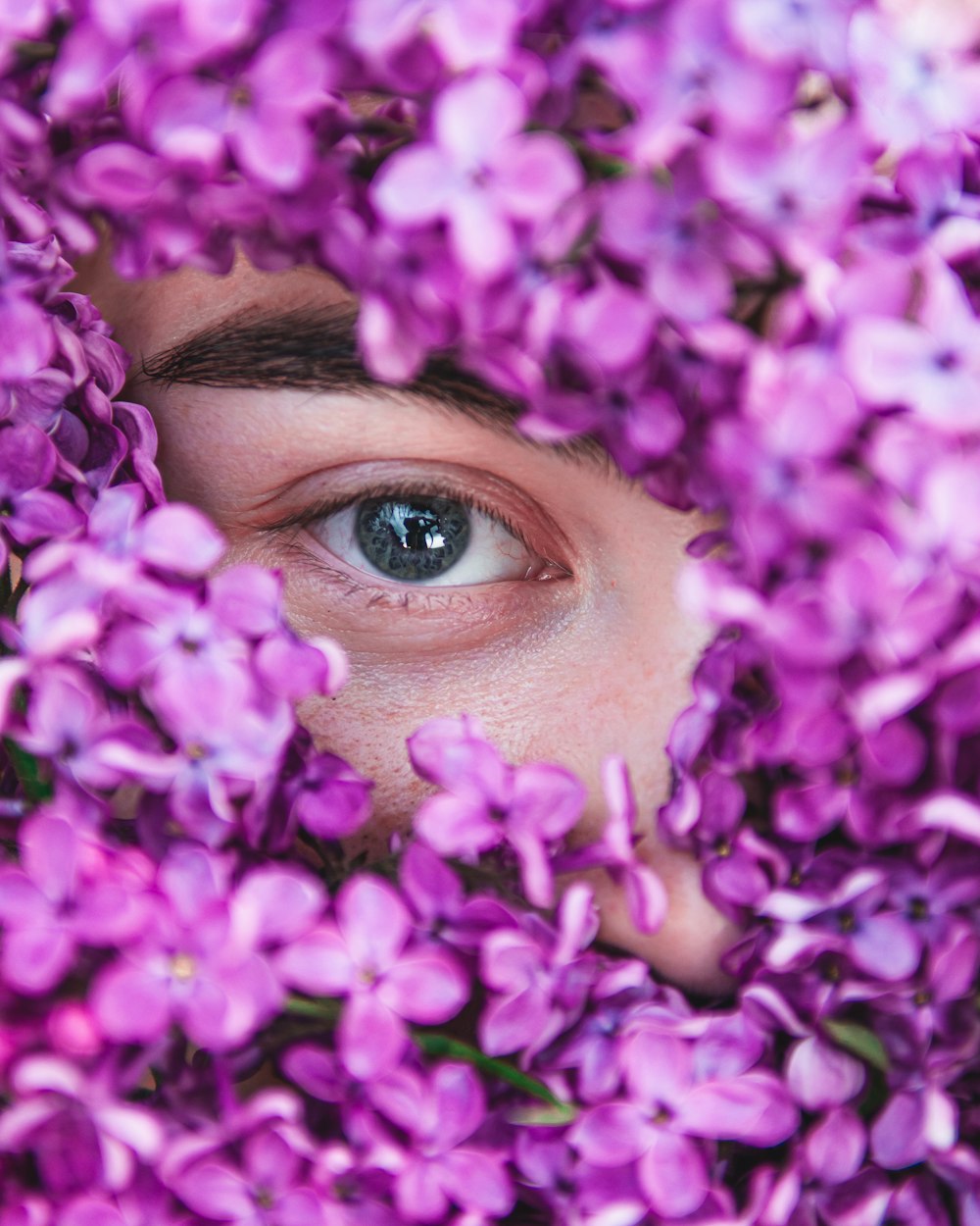 woman with purple flower on her head