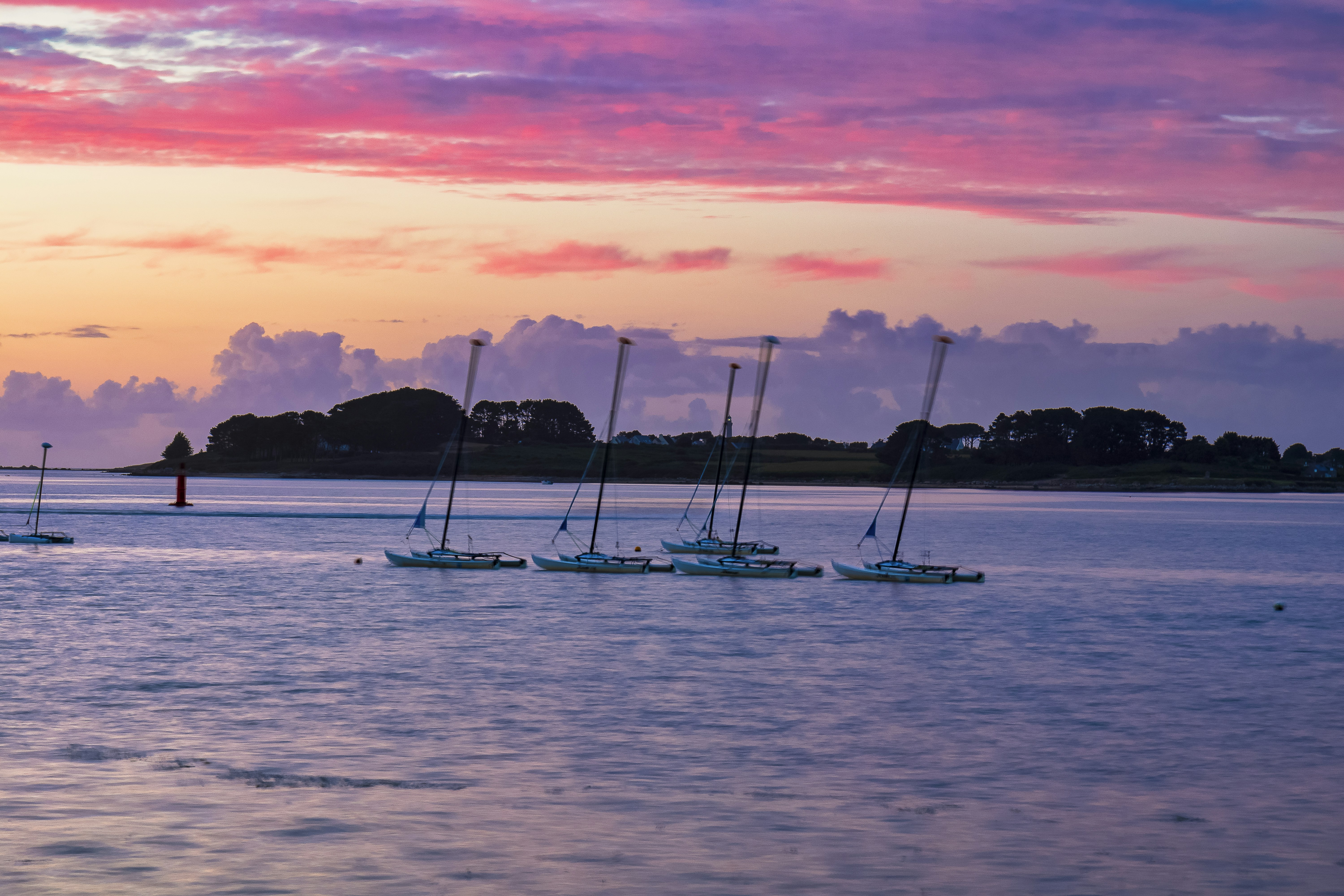 silhouette of boat on sea during sunset