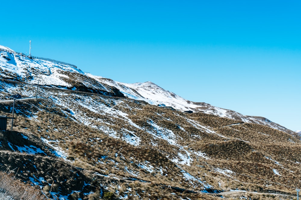 snow covered mountain under blue sky during daytime