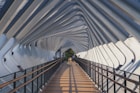 people walking on brown wooden bridge during daytime