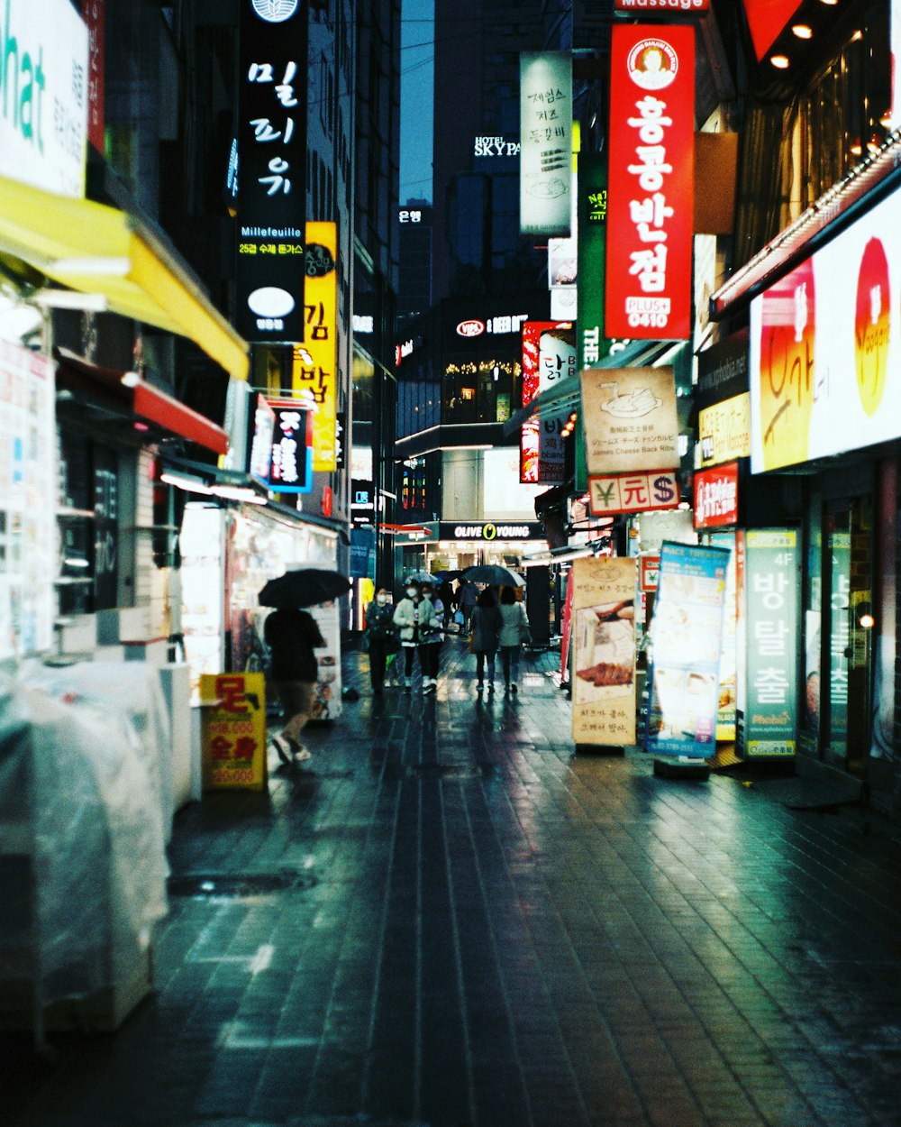 people walking on street during nighttime