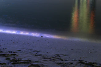 An animated clip of a waterfront property with gentle waves and soft lighting.