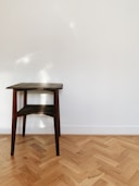 brown wooden seat on brown wooden parquet floor
