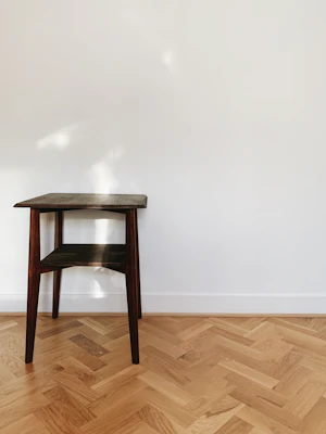 Wooden seat on a parquet floor