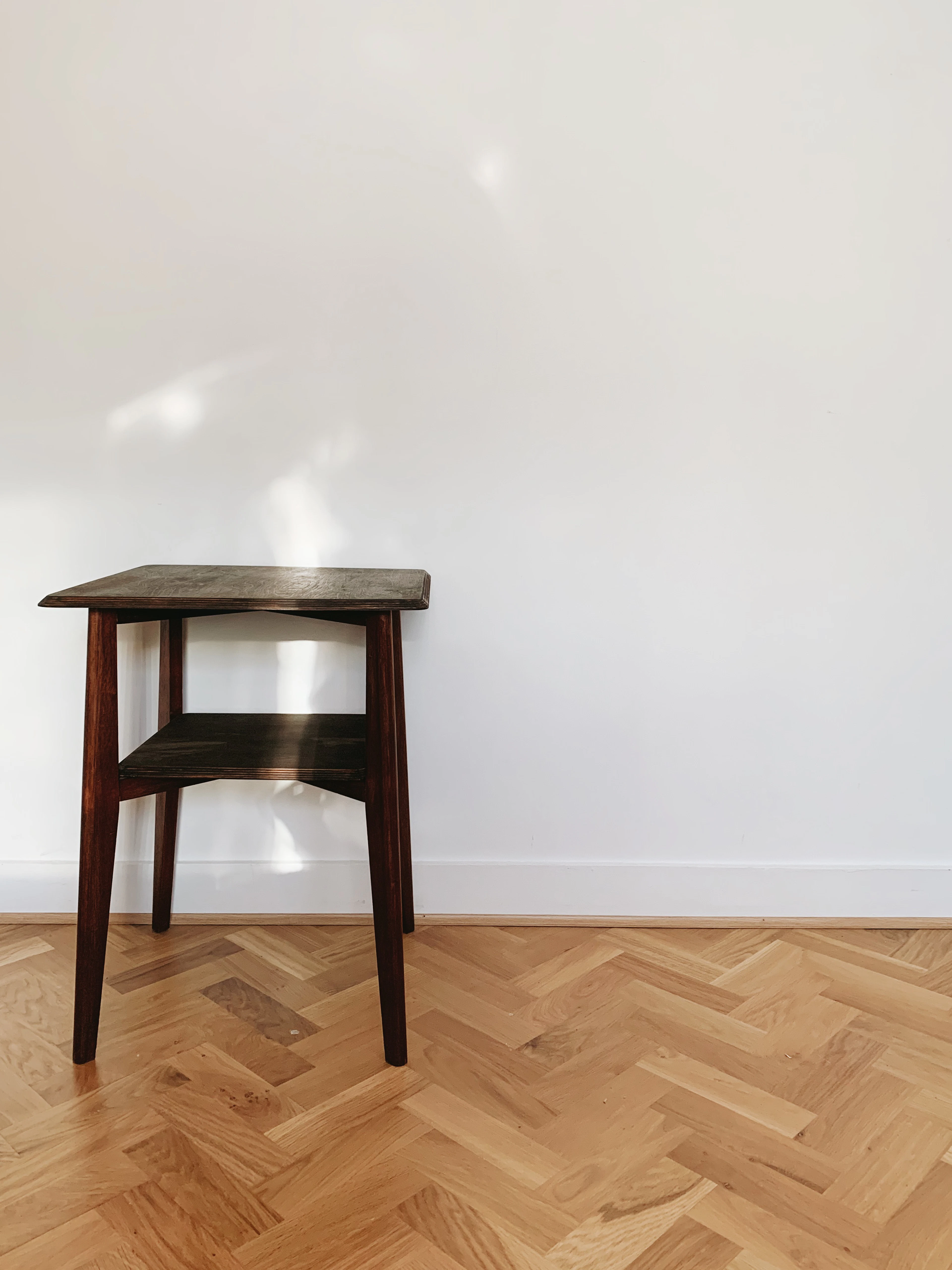 Wooden seat on a parquet floor