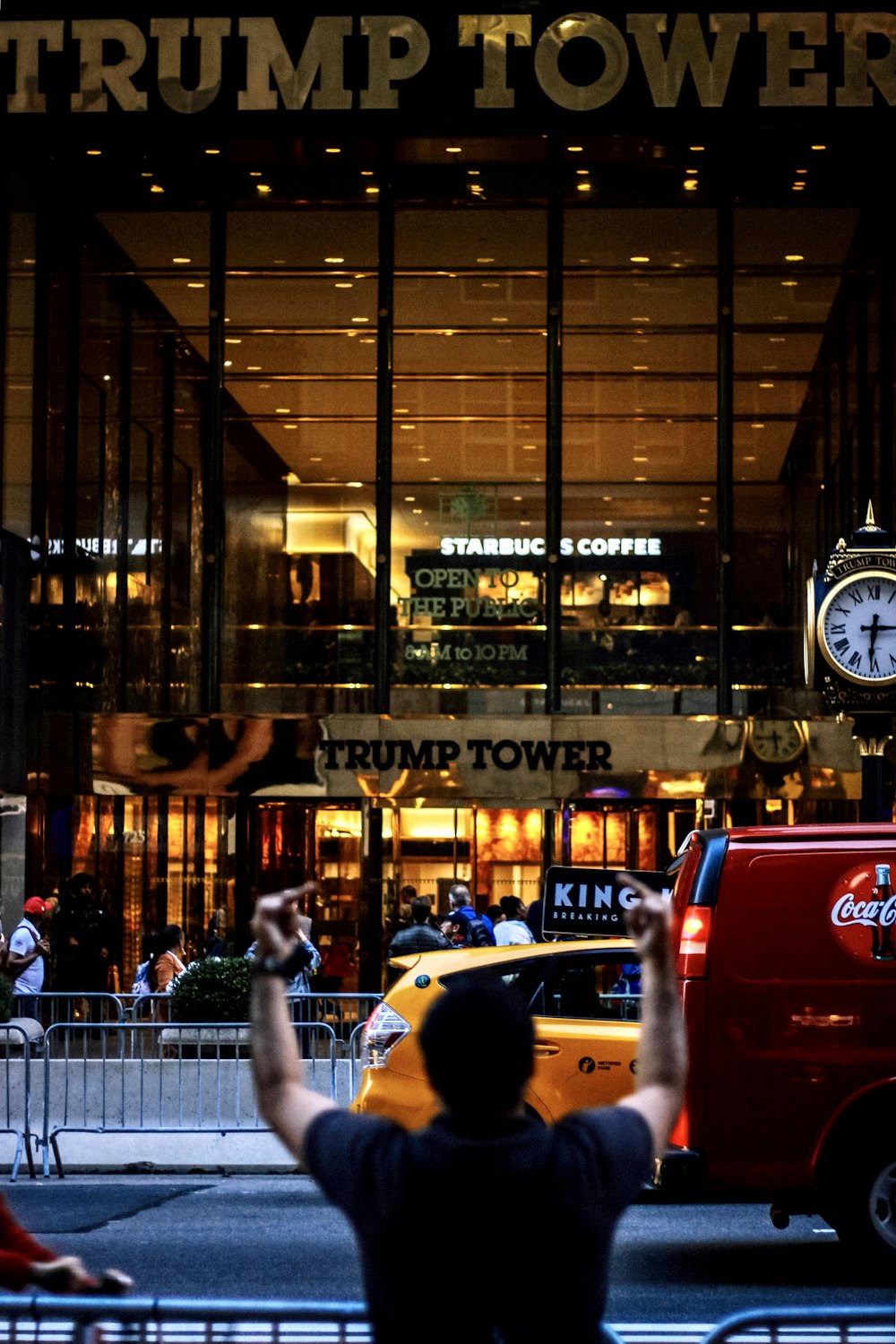 red car in front of store during night time