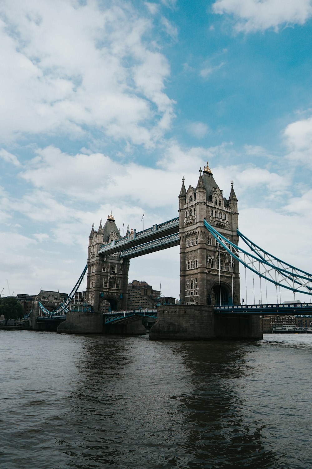 brown bridge under blue sky during daytime