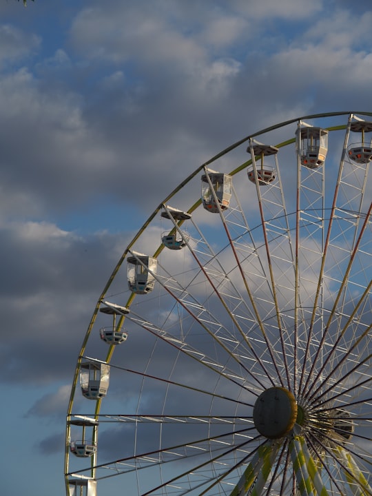 white ferris wheel under blue sky during daytime in Vincennes France