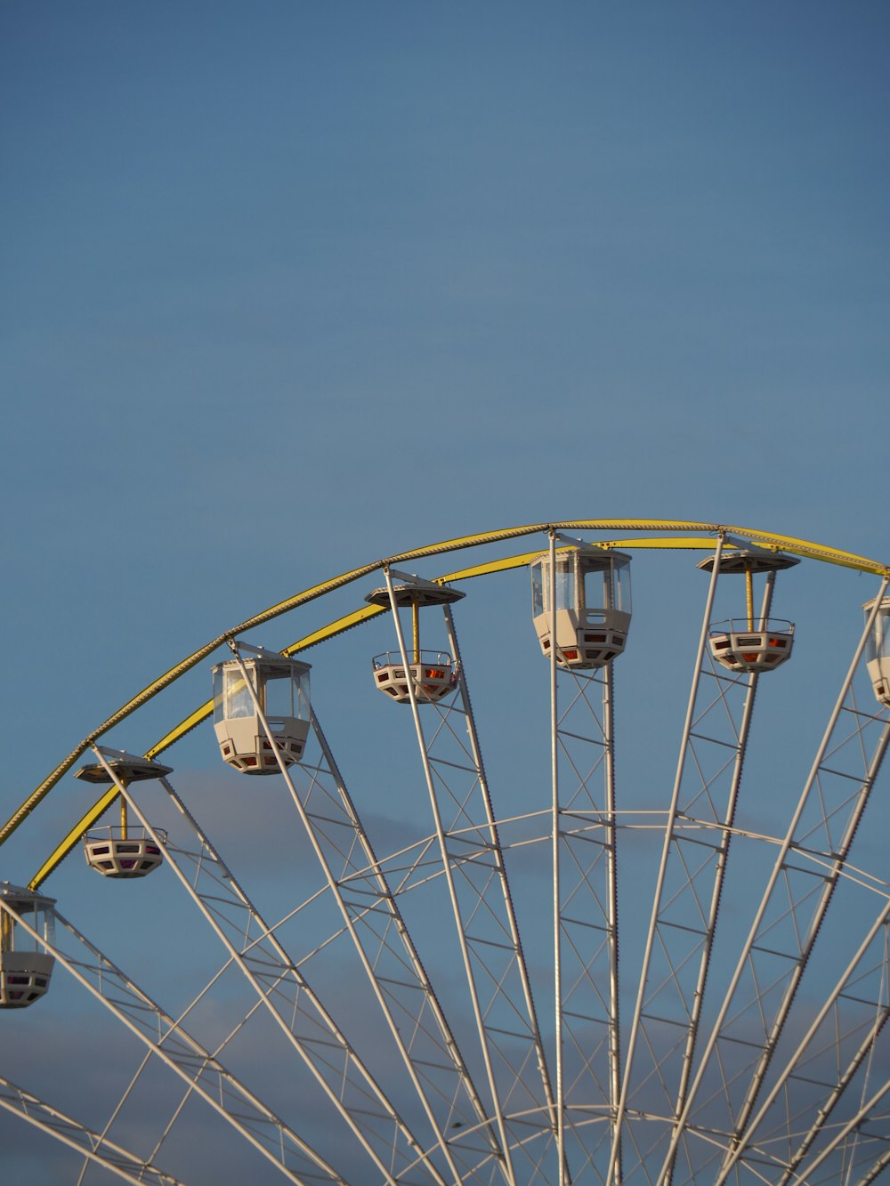 white ferris wheel under blue sky during daytime