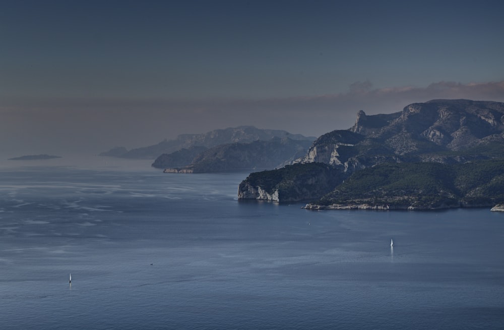 white sailboat on blue sea during daytime